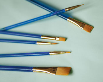 High angle view of colored pencils on white table