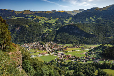 High angle view of trees and mountains against sky