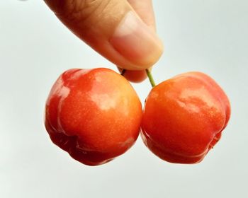 Close-up of strawberry over white background