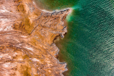 High angle view of rocks on sea