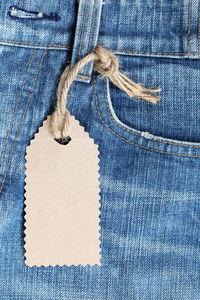 Close-up of label tied to jeans
