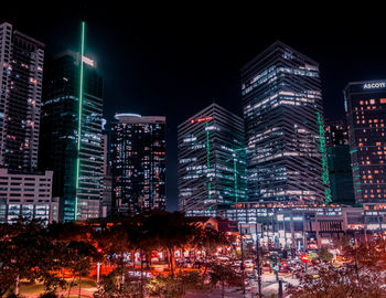 Illuminated buildings in city at night