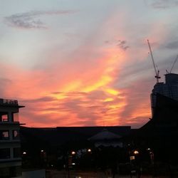 Built structure against cloudy sky at sunset