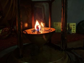 Close-up of lit diya at home