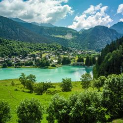 Scenic view of lake and mountains against sky