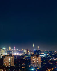 Illuminated buildings in city at night