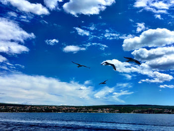 Scenic view of calm sea against cloudy sky