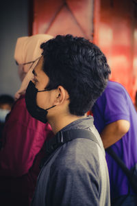 Portrait of young man looking away