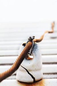 Close-up of rope tied on metal