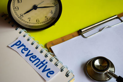 High angle view of clock on table