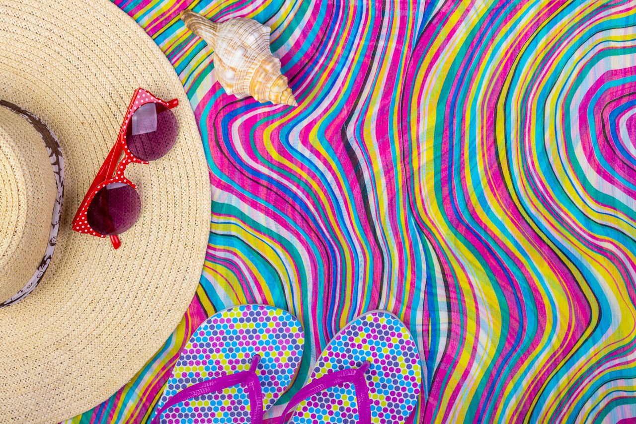 FULL FRAME SHOT OF MULTI COLORED HAT ON ROCK