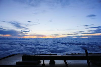 Scenic view of snow covered landscape against cloudy sky