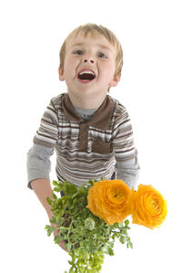 Portrait of smiling boy against white background