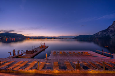 Scenic view of lake against sky at sunset