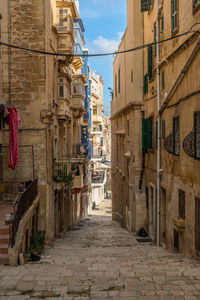 Narrow street amidst buildings in town