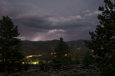 Scenic view of landscape against sky at night