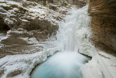 Johnston canyon frozen waterfall in winter