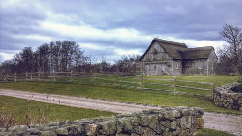 House on field against sky