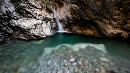 Water flowing through rocks in river