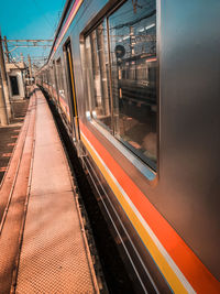 Blurred motion of train at railroad station