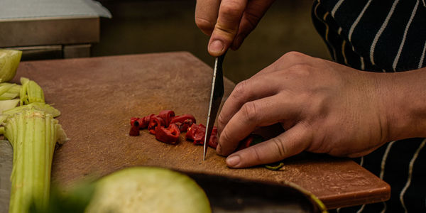 Midsection of man preparing food