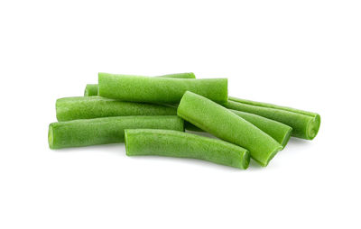 Close-up of green chili pepper against white background