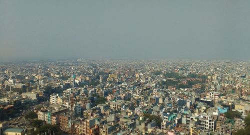 High angle view of buildings against sky in city