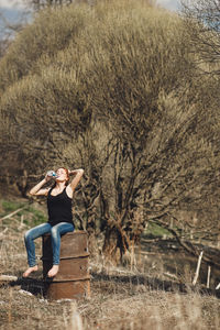 Rear view of woman on field