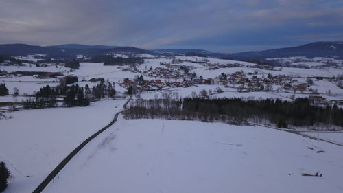 Scenic view of snow covered mountains against sky