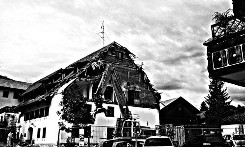 Low angle view of building against cloudy sky