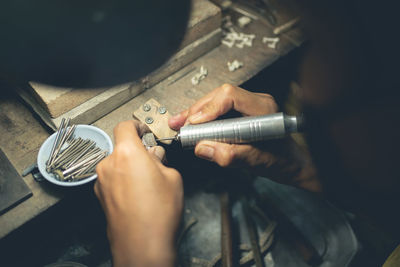 High angle view of man working on table