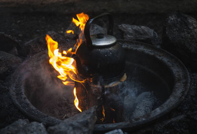 High angle view of kettle on fire