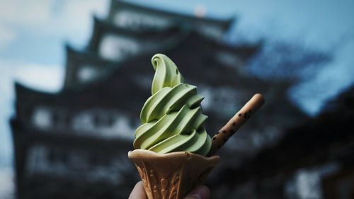 Close-up of cropped hand holding ice cream