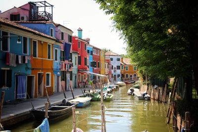 Boats moored in canal