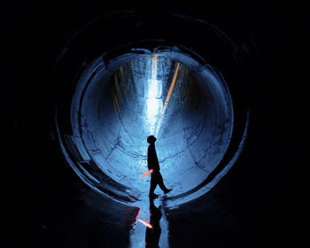 Man standing in tunnel