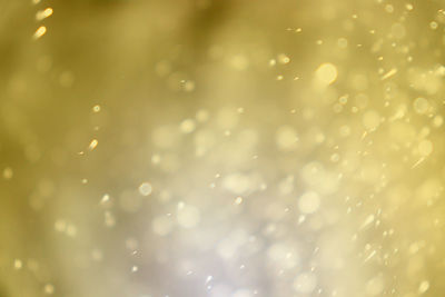 Full frame shot of raindrops on water