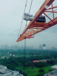 View of bridge in city against sky