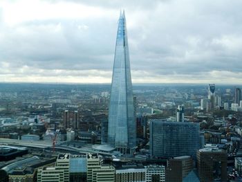 City skyline against cloudy sky