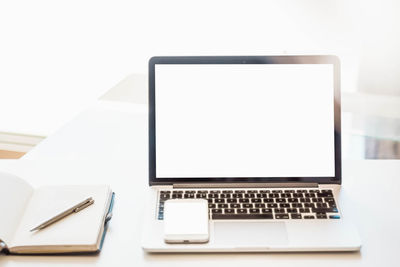 Close-up of laptop on table