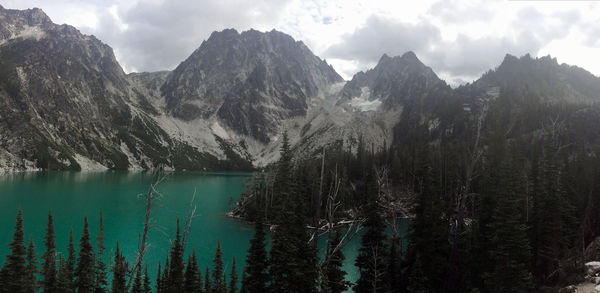 Scenic view of lake and mountains against sky