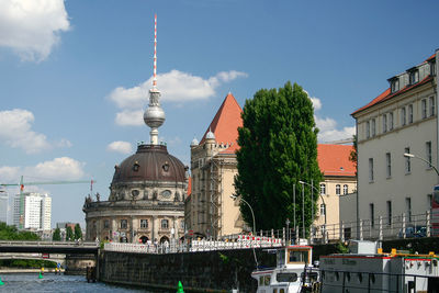 View of buildings in city against sky