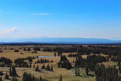 Scenic view of landscape against cloudy sky
