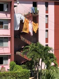Low angle view of clothes drying against buildings