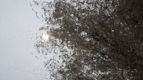 Full frame shot of raindrops on sea