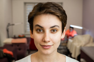 Close-up of young woman at home