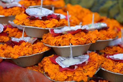 Close-up of religious offerings outdoors