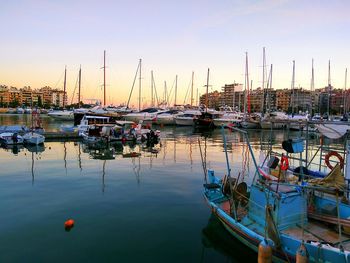 Boats moored at harbor