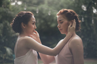 Two young women embracing