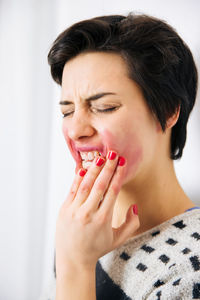 Young woman against white background