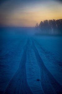 Scenic view of landscape against sky during winter